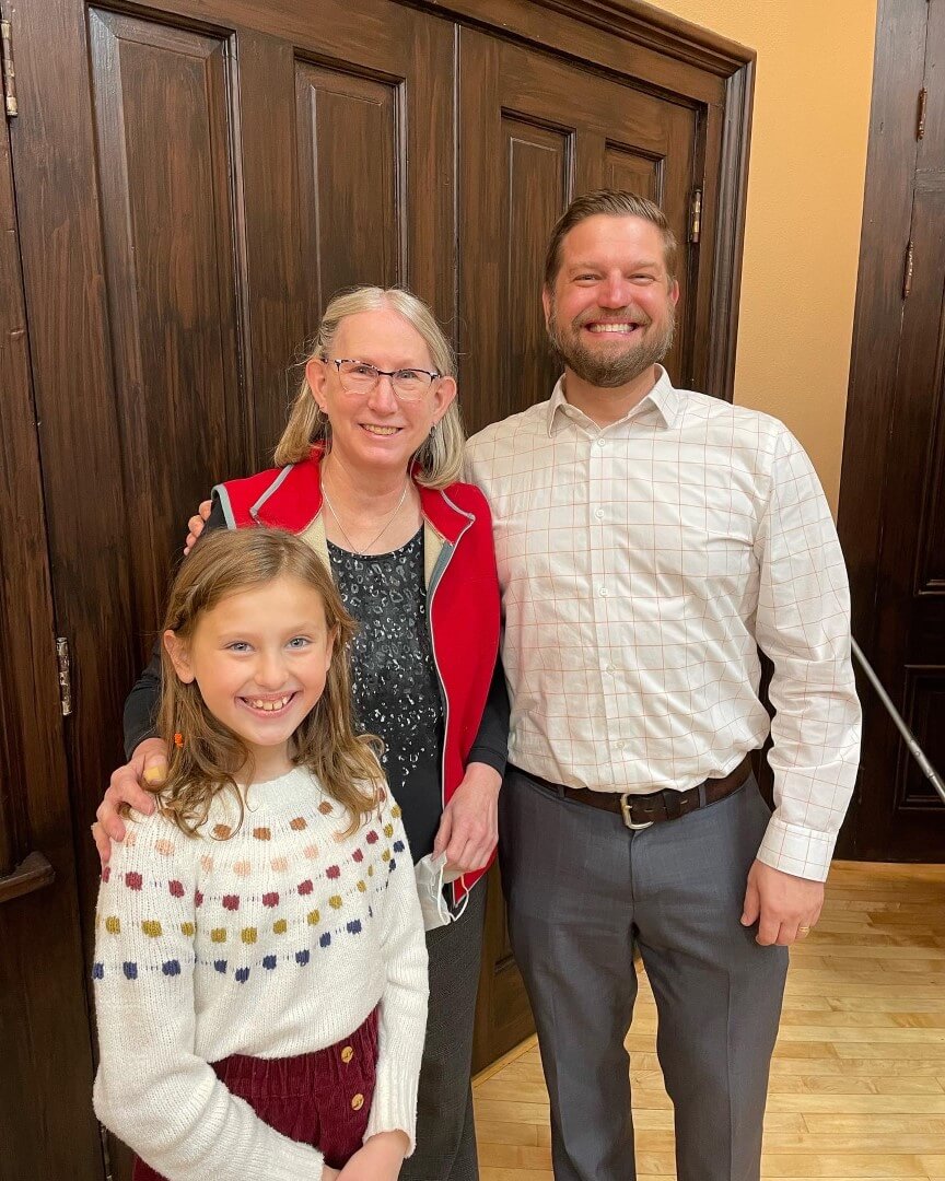 Dana with two students